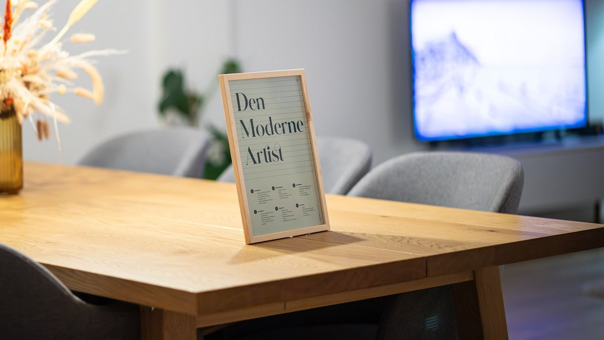 Music poster standing on dining table in Scandinavian living room